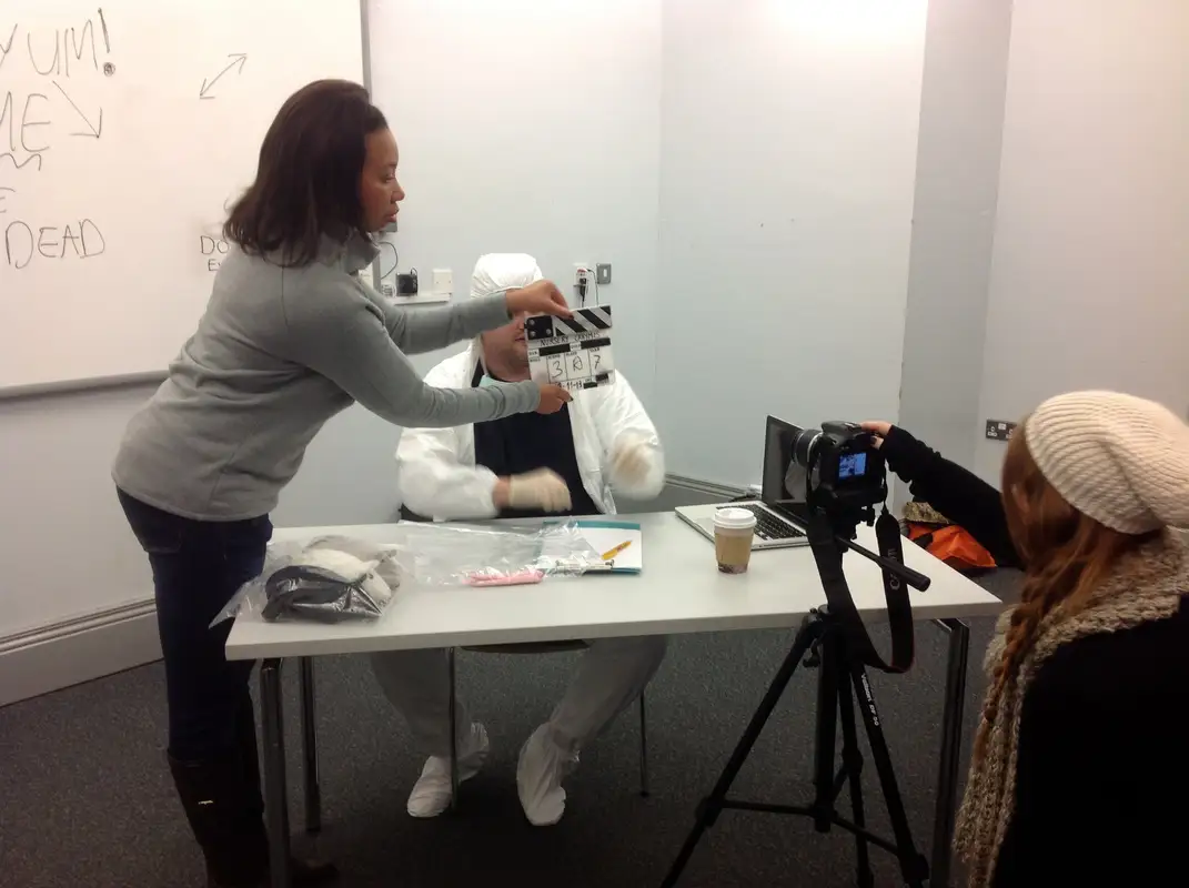 
					woman directing a film