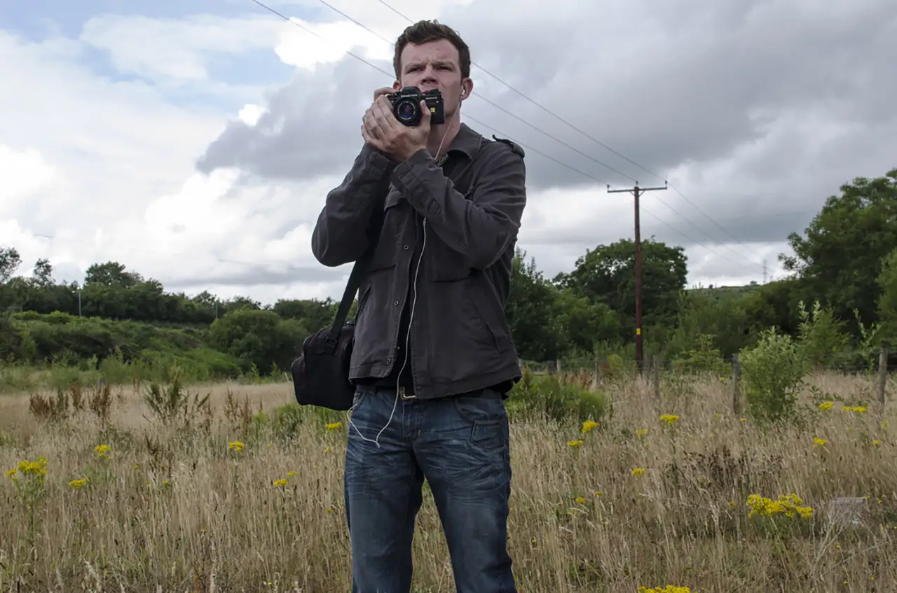 photographer in
					a field